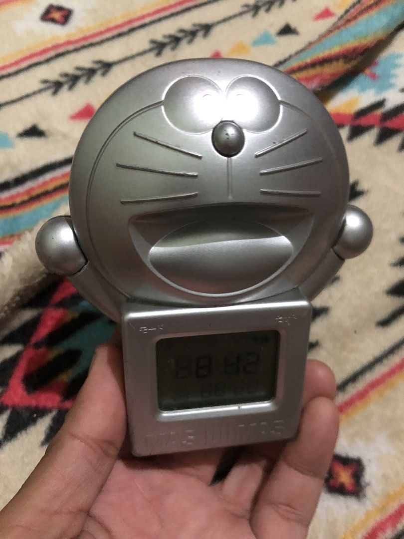 Doraemon silver desk timer and clock (Category: Clocks) located in Quezon City. Submitted by markgolveo (Listing ID 1435837136, Image 3). Description: Doraemon silver desk timer and clock Tested working Good display and sounds Press and hold to operate.