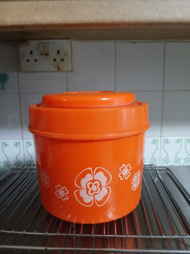 Egg maker (Category: Other Kitchen Appliances) located in Singapore. Submitted by great_day8 (Listing ID 1435840363, Image 2). Description: - Bright orange colour eggs maker - Features floral designs - Includes base and lid.