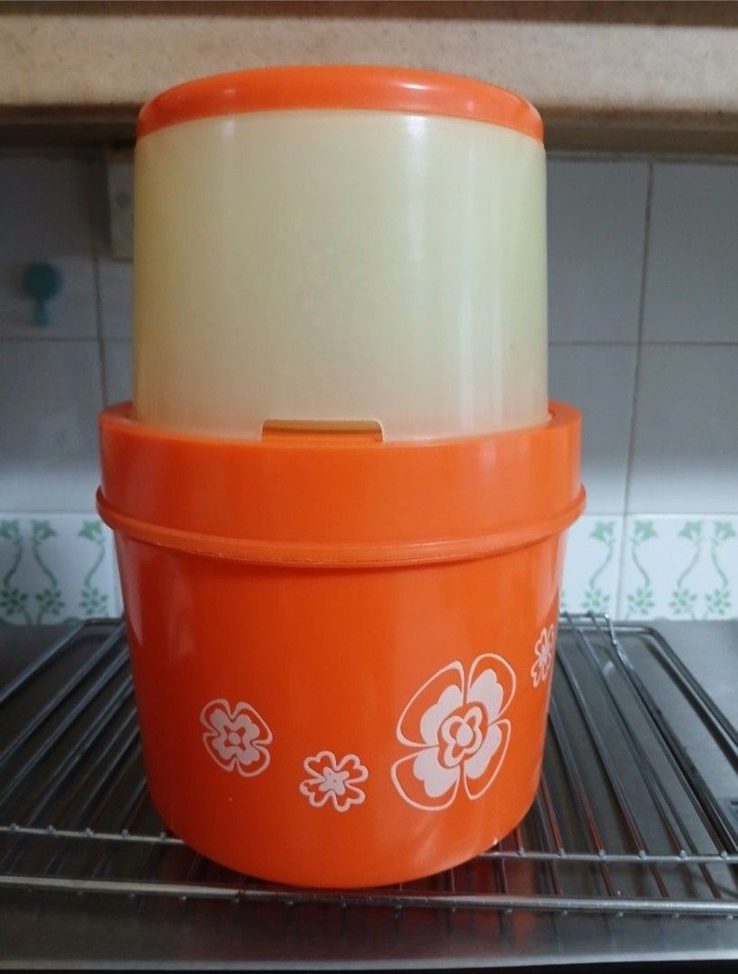 Egg maker (Category: Other Kitchen Appliances) located in Singapore. Submitted by great_day8 (Listing ID 1435840363, Image 1). Description: - Bright orange colour eggs maker - Features floral designs - Includes base and lid.