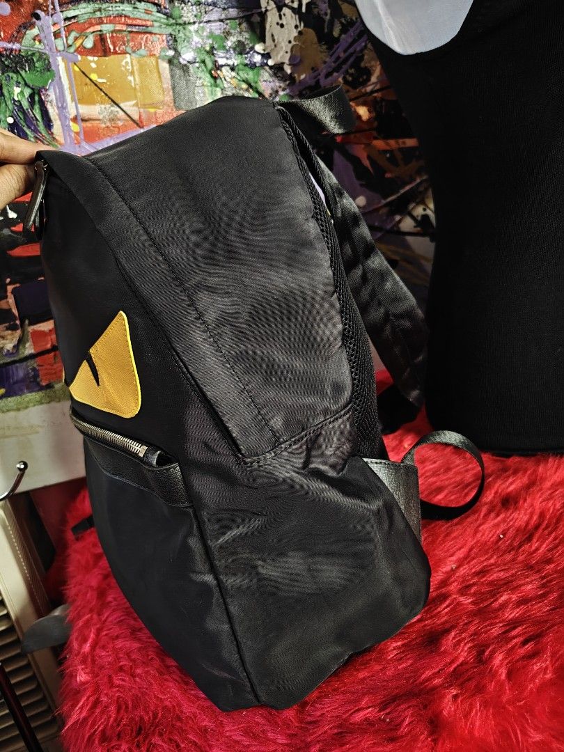 Fendi Monster Eyes Backpack (Category: Backpacks) located in Las Pinas. Submitted by liezel49 (Listing ID 1435874059, Image 2). Description: - Fendi Monster Eyes design backpack - Front zippered pocket - Adjustable shoulder straps - Top handle - Mesh back panel - Silver-toned hardware.