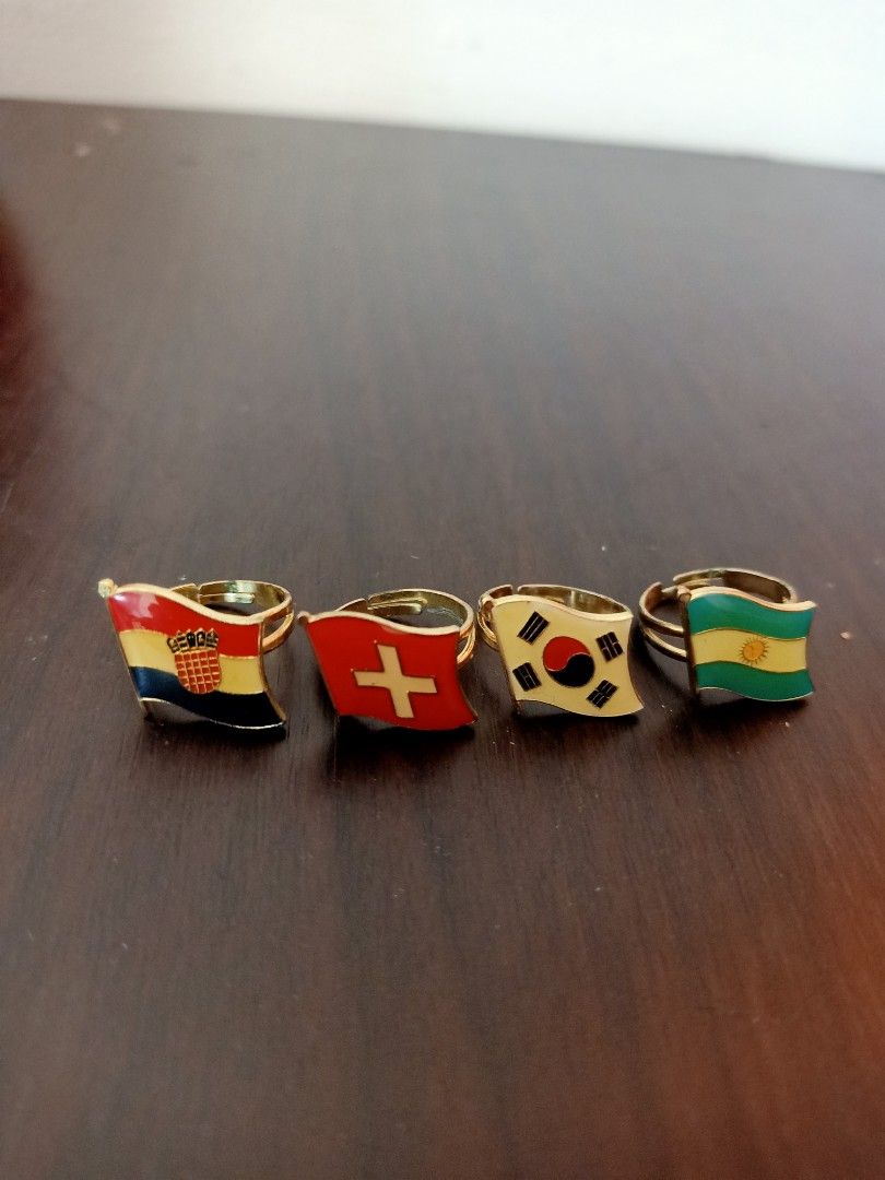 Flag Rings - Set of 4 (Category: Rings) located in Las Pinas. Submitted by the_recycle_shop (Listing ID 1435774276, Image 1). Description: - Set of four rings - Features flags of different countries - Gold-colored adjustable band - Flags are enamel or painted - Flags in their respective colors.
