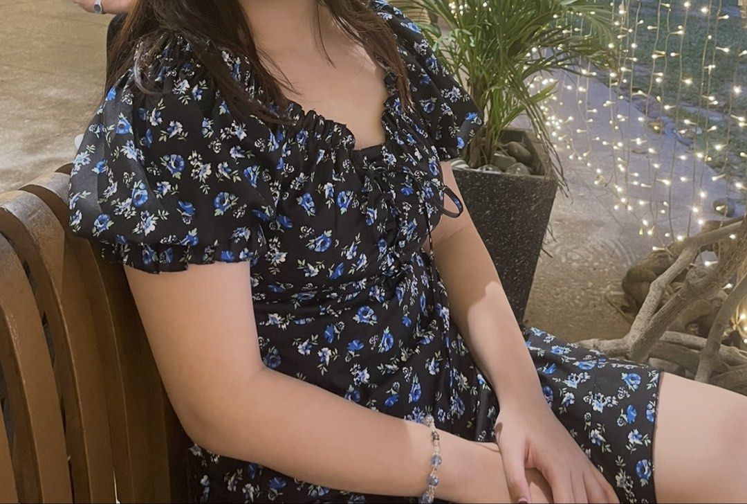 Floral Off-Shoulder Dress (Category: Dresses) located in Angeles City. Submitted by hansu.j (Listing ID 1435827600, Image 3). Description: - Black dress with a blue floral pattern - Off-shoulder design - Ruffled neckline and sleeves - Tie-up detail at the bust - Flowy skirt - Lightweight fabric - Medium Size.