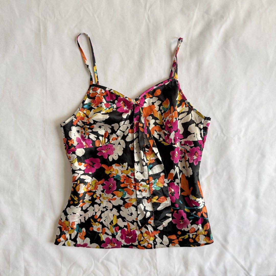 Floral Print Camisole (Category: Sleeveless) located in Makati City. Submitted by haileysarchives (Listing ID 1435740203, Image 1). Description: - Floral print camisole - Black background - Thin spaghetti straps - V-neckline - Silky fabric - Pleated front detail - Sleeveless design - Ideal for warm weather or layering.