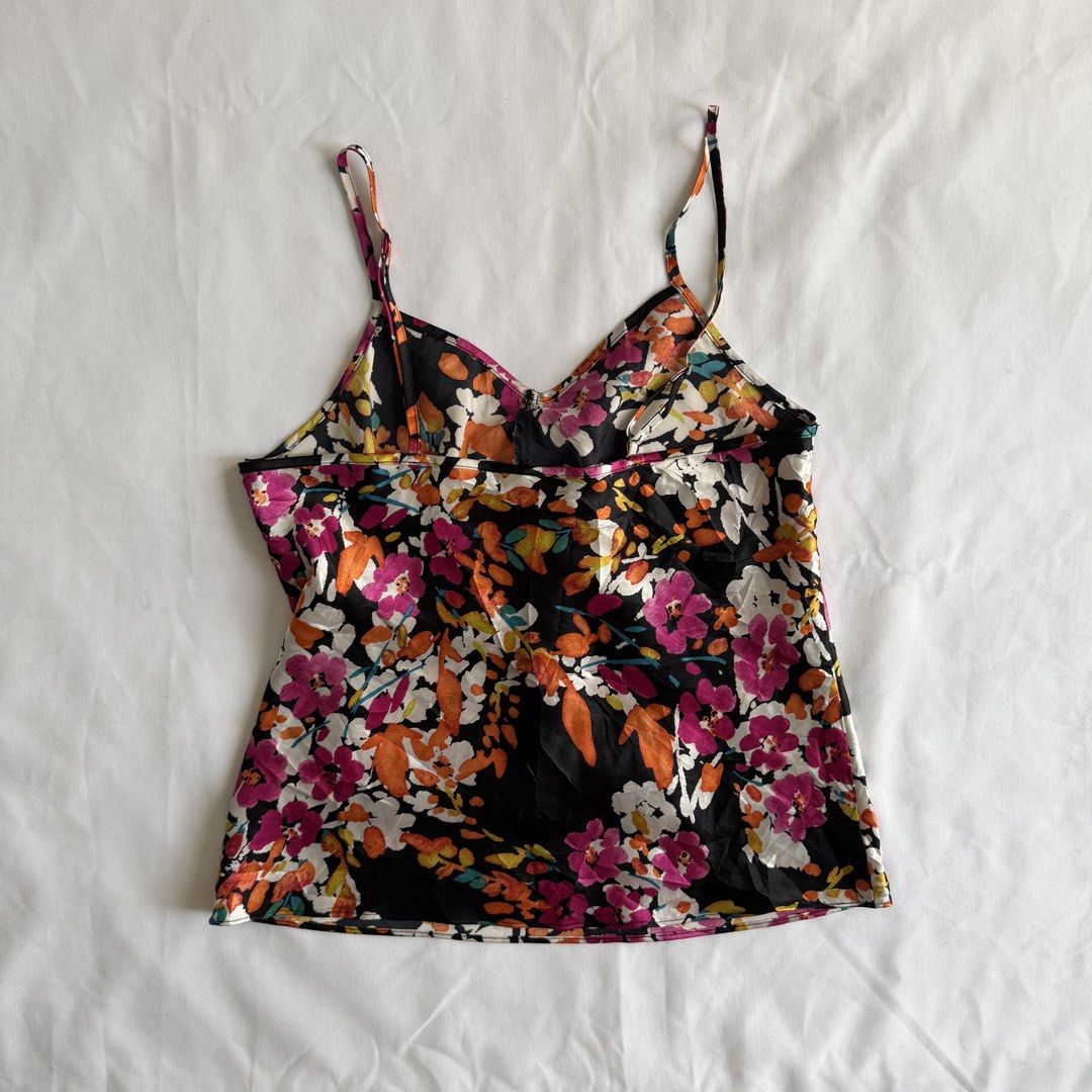 Floral Print Camisole (Category: Sleeveless) located in Makati City. Submitted by haileysarchives (Listing ID 1435740203, Image 2). Description: - Floral print camisole - Black background - Thin spaghetti straps - V-neckline - Silky fabric - Pleated front detail - Sleeveless design - Ideal for warm weather or layering.