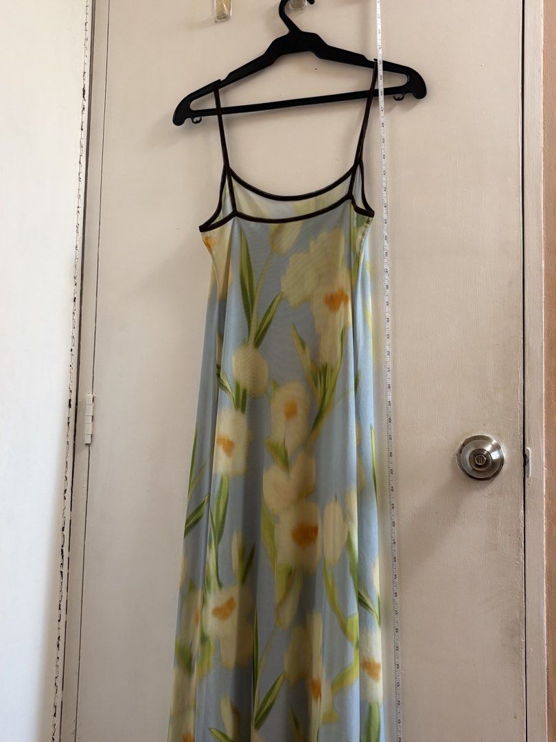 Floral Print Spaghetti Strap Dress (Category: Dresses) located in Dasmarinas. Submitted by marii. (Listing ID 1435880295, Image 3). Description: - Floral maxi dress - Delicate yellow and green floral print on light blue background - Spaghetti straps - Mesh overlay - Dark brown trim on neckline and straps - S-M.