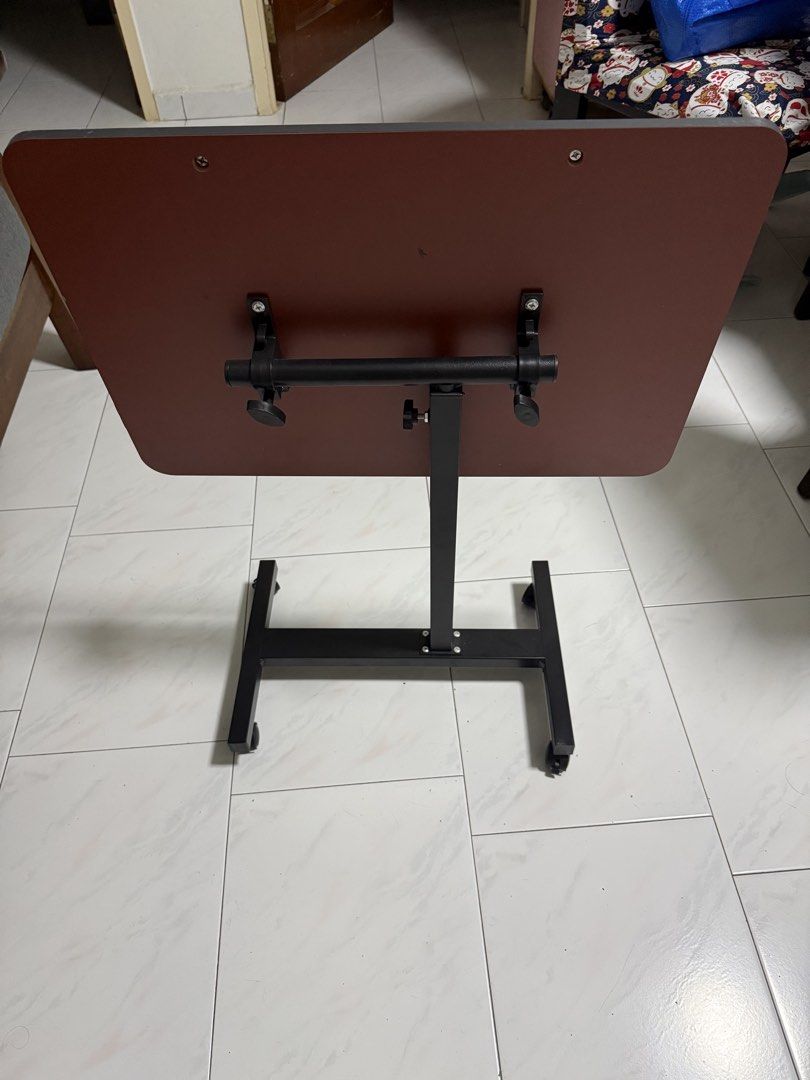Foldable Table (Category: Other Home Furniture) located in Singapore. Submitted by zapdeals_sg (Listing ID 1435908684, Image 2). Description: 低价出售几乎全新的可调节高低的可折叠的小桌，适合床边、沙发边可移动的桌子，有意者联系王小姐91897482.
