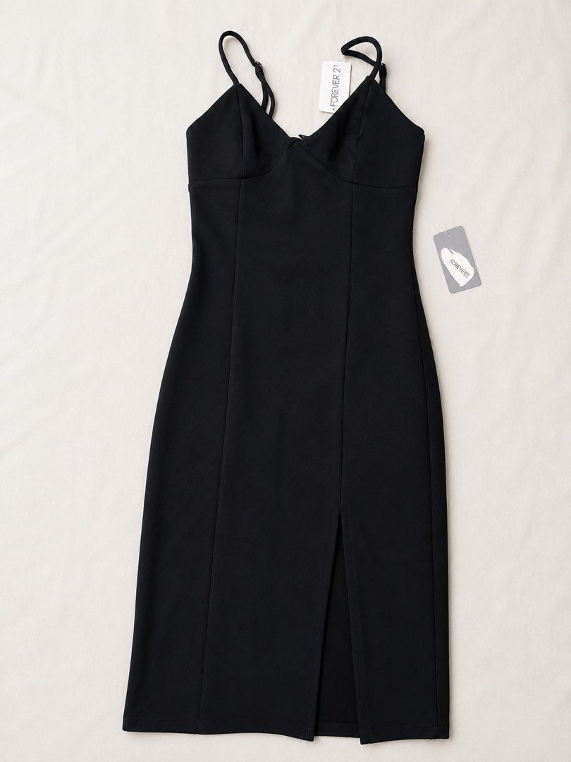 Forever 21 Black Midi Dress (Category: Dresses) located in Pasig City. Submitted by phey05 (Listing ID 1435828687, Image 1). Description: - Forever 21 black midi dress - Fitted bodice - Spaghetti straps - Front slit - Brand new with tags - Perfect for special occasions and nights out - Original Price: P755.00 (with tag).