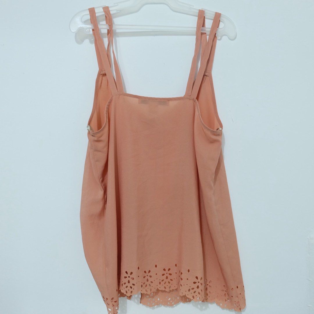 Forever 21 Peach Eyelet Hem Button-Up Camisole (Size M) (Category: Sleeveless) located in Manila. Submitted by thecooldeclutterer (Listing ID 1435860084, Image 2). Description: • Brand: Forever 21 • Size: Medium (M/M) • Color: Peach / Coral • Features: Sleeveless camisole with a V-neckline, functional gold-tone front buttons, and a decorative laser-cut eyelet floral hem • Design: Double spaghetti straps and a straight-cut back KEYWORDS Forever 21
