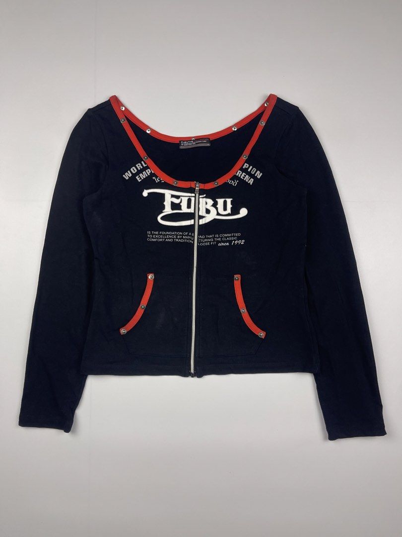 FUBU Vintage Graphic Zip-Up Top (Category: Longsleeves) located in Cagayan de Oro. Submitted by kmcurations (Listing ID 1435861287, Image 1). Description: FUBU Vintage Graphic Zip-Up Top • Price: PHP 300 • Brand: FUBU The Collection • Design: Rare vintage-style long-sleeve top featuring a full zip-up front and a deep, rounded off-shoulder neckline • Color: Classic black with vibrant red contrast trim • Features: • Large white FUBU logo graphic on
