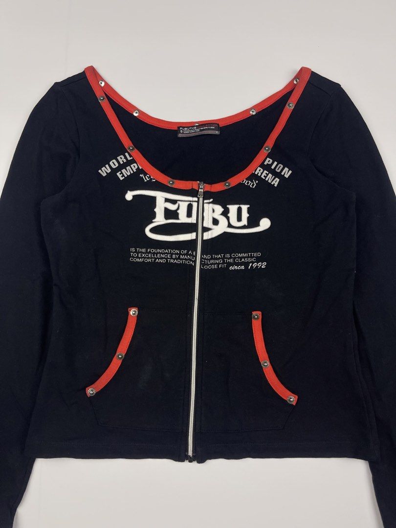 FUBU Vintage Graphic Zip-Up Top (Category: Longsleeves) located in Cagayan de Oro. Submitted by kmcurations (Listing ID 1435861287, Image 2). Description: FUBU Vintage Graphic Zip-Up Top • Price: PHP 300 • Brand: FUBU The Collection • Design: Rare vintage-style long-sleeve top featuring a full zip-up front and a deep, rounded off-shoulder neckline • Color: Classic black with vibrant red contrast trim • Features: • Large white FUBU logo graphic on