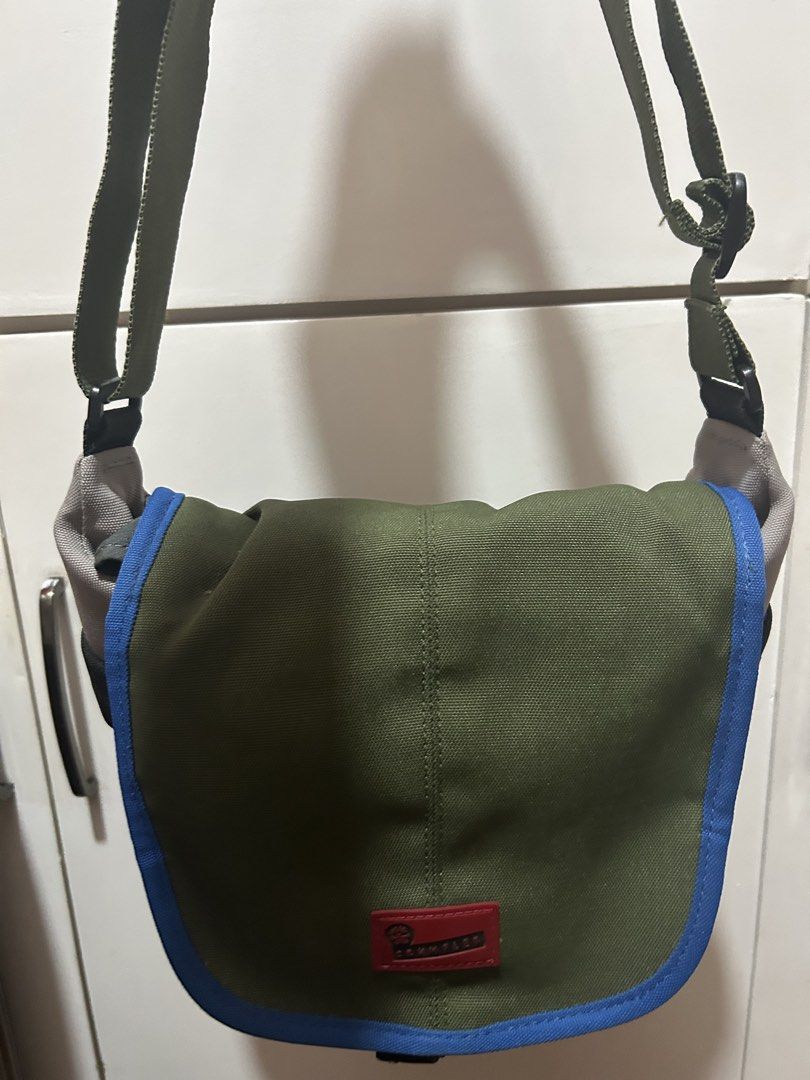 Green Messenger Bag with Blue Accents (Category: Luxury Bags & Wallets) located in Taguig. Submitted by shepai (Listing ID 1435844448, Image 1). Description: - Stylish green messenger bag - Features blue and gray accents - Main compartment with blue lining - Adjustable strap for comfortable carrying - Small logo detail - Ideal for everyday use.