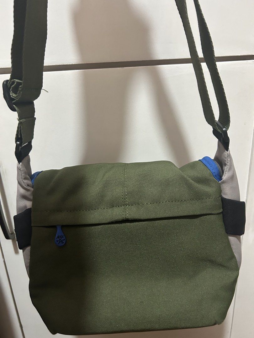 Green Messenger Bag with Blue Accents (Category: Luxury Bags & Wallets) located in Taguig. Submitted by shepai (Listing ID 1435844448, Image 2). Description: - Stylish green messenger bag - Features blue and gray accents - Main compartment with blue lining - Adjustable strap for comfortable carrying - Small logo detail - Ideal for everyday use.