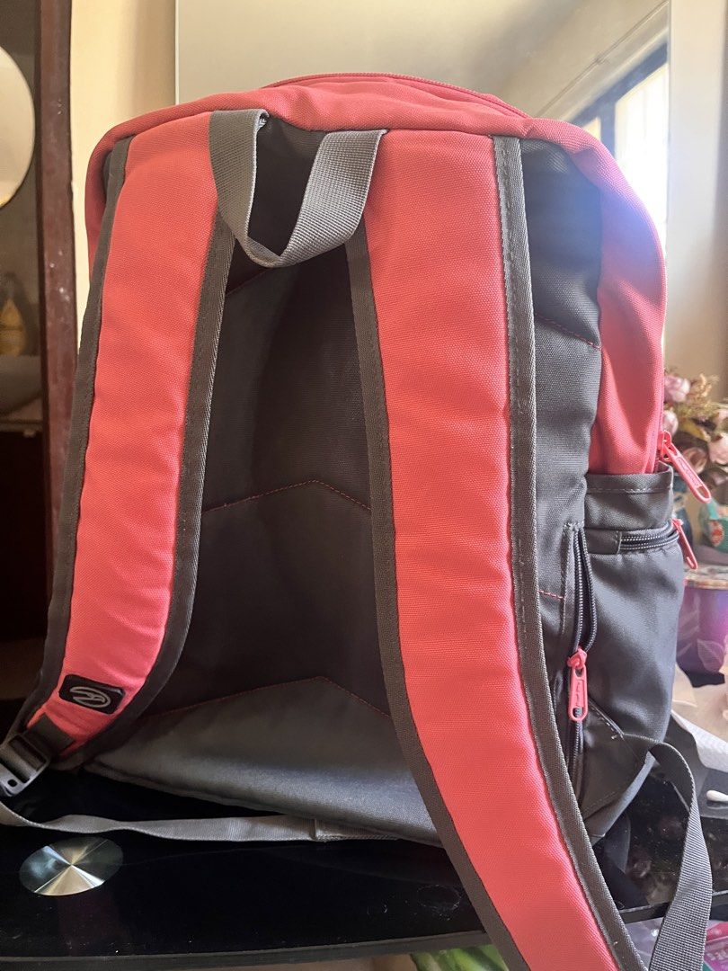 Hawk Backpack - Coral and Gray (Category: Backpacks) located in Rizal. Submitted by authenticity17 (Listing ID 1435825439, Image 3). Description: - Hawk backpack - Coral and gray color scheme - Multiple zippered compartments - Front and side pockets - Padded shoulder straps - Top handle - Interior pocket - Hawk logo visible - Durable and functional.