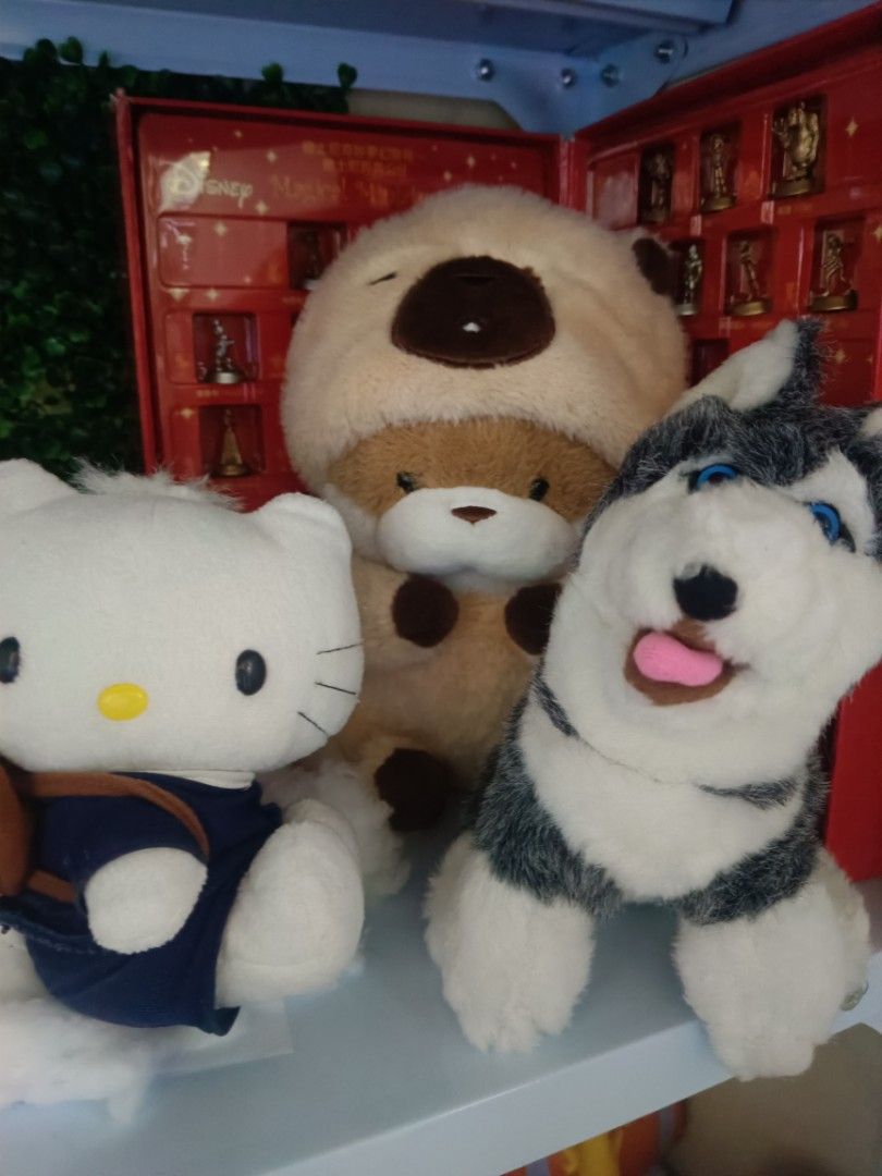 Hello Kitty, Bear, and Husky Plush Toys (Category: Plushies & Soft Toys) located in Baliuag. Submitted by migsrob (Listing ID 1435906973, Image 1). Description: - Kitty plush in a blue outfit. - Bear plush with a brown hood. - Husky plush with blue eyes and a pink tongue. - Perfect for collectors or gifts..