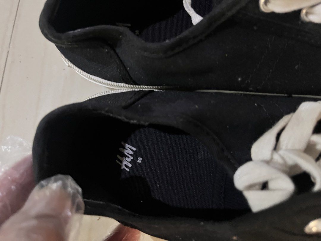 H&M Black Canvas Shoes - Size 38 (Category: Heels) located in Rizal. Submitted by authenticity17 (Listing ID 1435827131, Image 2). Description: - H&M black canvas shoes - Size 38 - White laces and sole - Classic, casual design - Suitable for everyday wear - Soles show some wear.