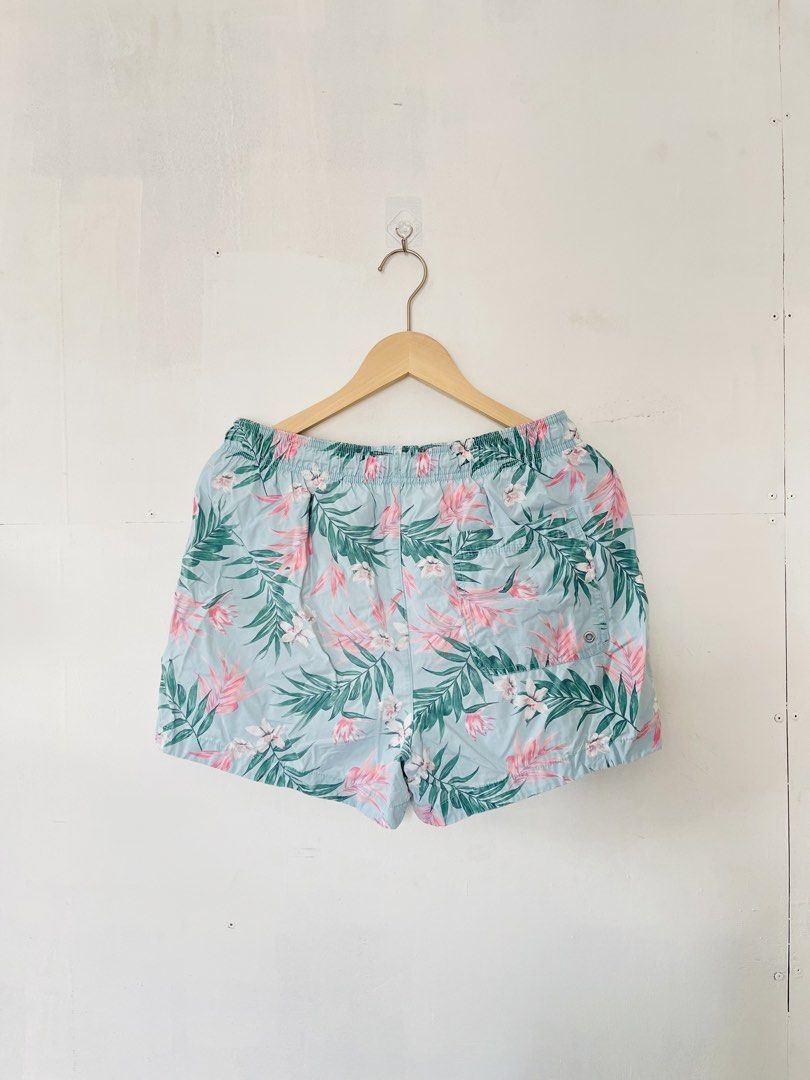 H&M Floral Swim Shorts (Category: Shorts) located in Cotabato. Submitted by aripov11 (Listing ID 1435745849, Image 1). Description: - H&M swim shorts - Size: M - Color: Light blue base with pink and green floral pattern - Features: Drawstring waist, mesh lining.