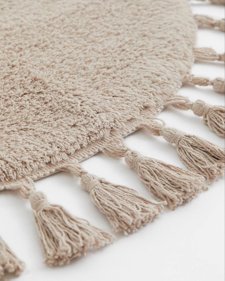 H&M Round Tassel Greige Bath Mat Rug (Category: Carpets, Mats & Flooring) located in Marikina City. Submitted by preloved.mana (Listing ID 1435902201, Image 2). Description: - Round, Diameter: 28in / 70cm - Greige color - tassels around the edge - cotton material - anti slip protector at back - washed once, cause of slight discoloration in some parts - still good quality, no loose threads and intact tassels -MOP: gcash, maya, bpi qr - MOD: lalamo