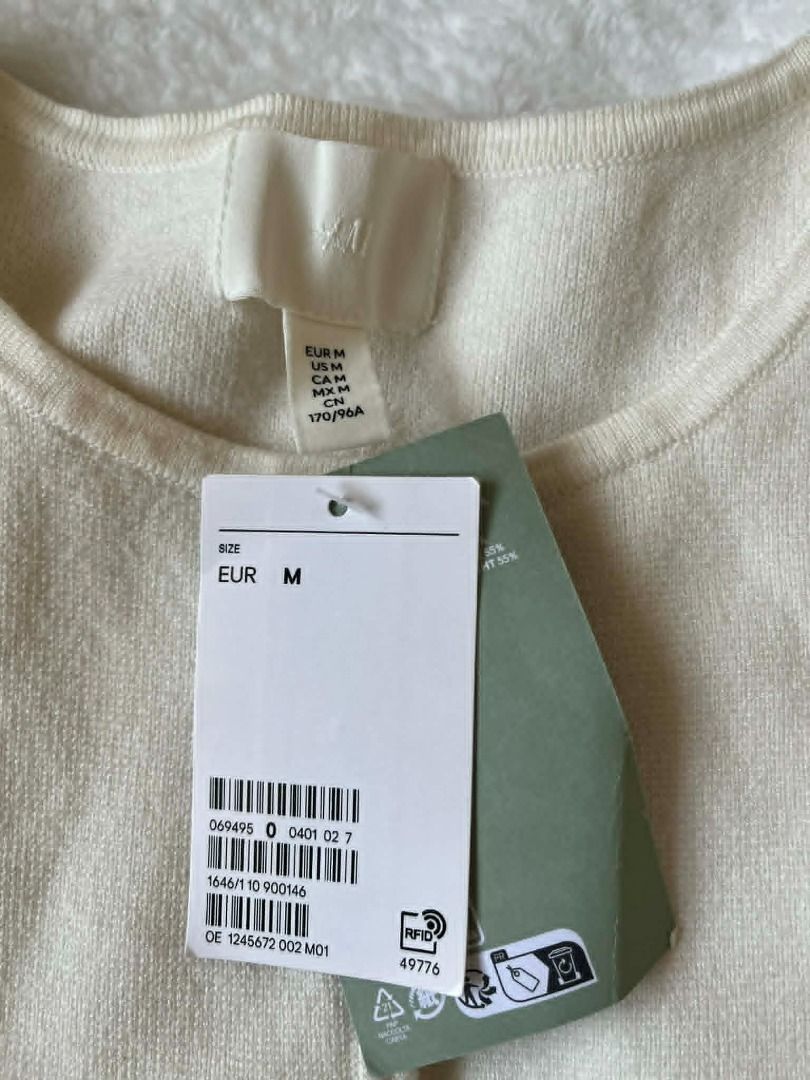 H&M White Knit Cardigan (Category: Coats, Jackets and Outerwear) located in Pasig City. Submitted by closet_reframe (Listing ID 1435885706, Image 2). Description: Brand New with tags, very pretty and elegant. Demin skirt and heels are also for sale! S:M.