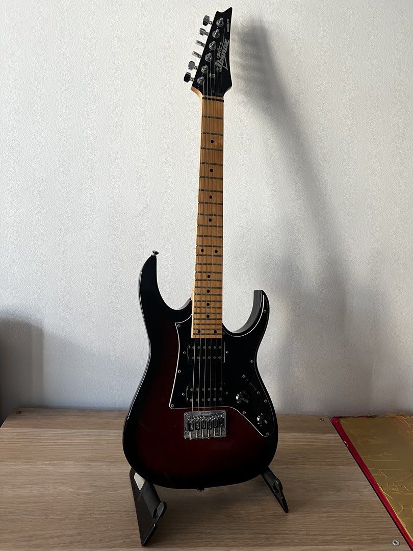 Ibanez Mikro Electric Guitar Set (Category: Musical Instruments) located in Makati City. Submitted by whiskey9 (Listing ID 1435806479, Image 1). Description: - Ibanez Mikro GRGM21M Walnut Sunburst - Condition: 9/10 (slight scratch at the back where the guitar rests on the stand) - Includes iRig HD X (no box but guaranteed authentic, used once to test) - Includes used guitar cable, Ibanez guitar stand, Ibanez Mikro original gig bag - Sold as a ful