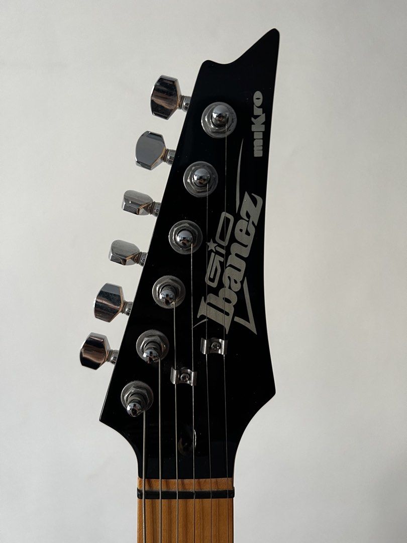 Ibanez Mikro Electric Guitar Set (Category: Musical Instruments) located in Makati City. Submitted by whiskey9 (Listing ID 1435806479, Image 3). Description: - Ibanez Mikro GRGM21M Walnut Sunburst - Condition: 9/10 (slight scratch at the back where the guitar rests on the stand) - Includes iRig HD X (no box but guaranteed authentic, used once to test) - Includes used guitar cable, Ibanez guitar stand, Ibanez Mikro original gig bag - Sold as a ful
