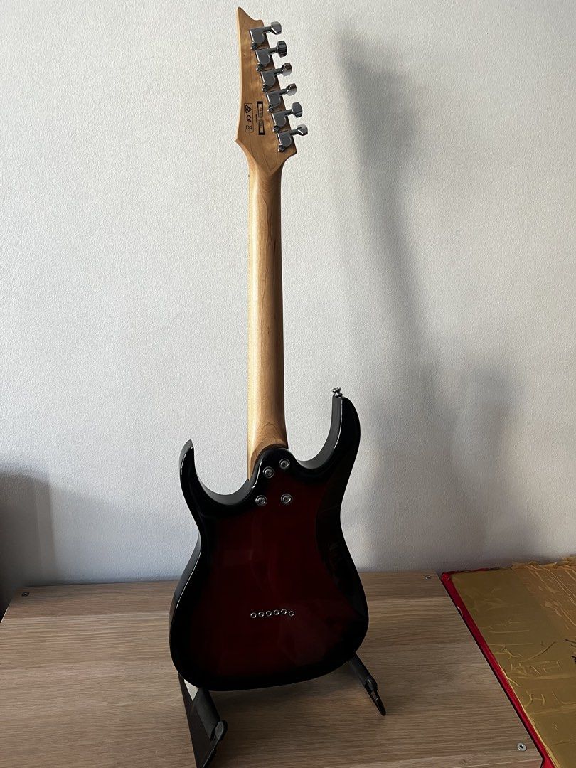 Ibanez Mikro Electric Guitar Set (Category: Musical Instruments) located in Makati City. Submitted by whiskey9 (Listing ID 1435806479, Image 2). Description: - Ibanez Mikro GRGM21M Walnut Sunburst - Condition: 9/10 (slight scratch at the back where the guitar rests on the stand) - Includes iRig HD X (no box but guaranteed authentic, used once to test) - Includes used guitar cable, Ibanez guitar stand, Ibanez Mikro original gig bag - Sold as a ful
