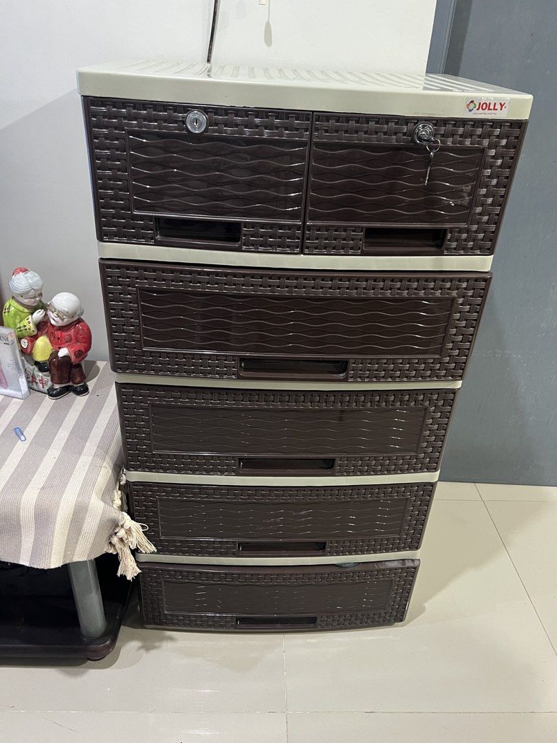 Jolly 5-Layer Storage Cabinet (Category: Shelves, Cabinets & Racks) located in Manila. Submitted by ruizaaa (Listing ID 1435742588, Image 2). Description: RFS: decluttering - Jolly 5-layer storage cabinet - Beige top and brown drawers - Suitable for various items - Practical storage solution for any room.