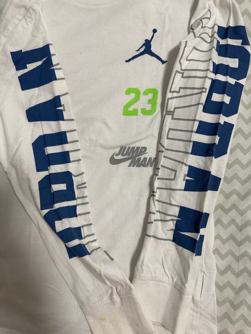 Jordan Long Sleeve Shirt (Category: Babies & Kids Fashion) located in Manila. Submitted by classywardrobemanila (Listing ID 1435828017, Image 2). Description: - White long sleeve shirt - Jordan logo and '23' on front - 'JORDAN' print on sleeves - Crew neck - Size: 8-10 years old - Minor stains present.