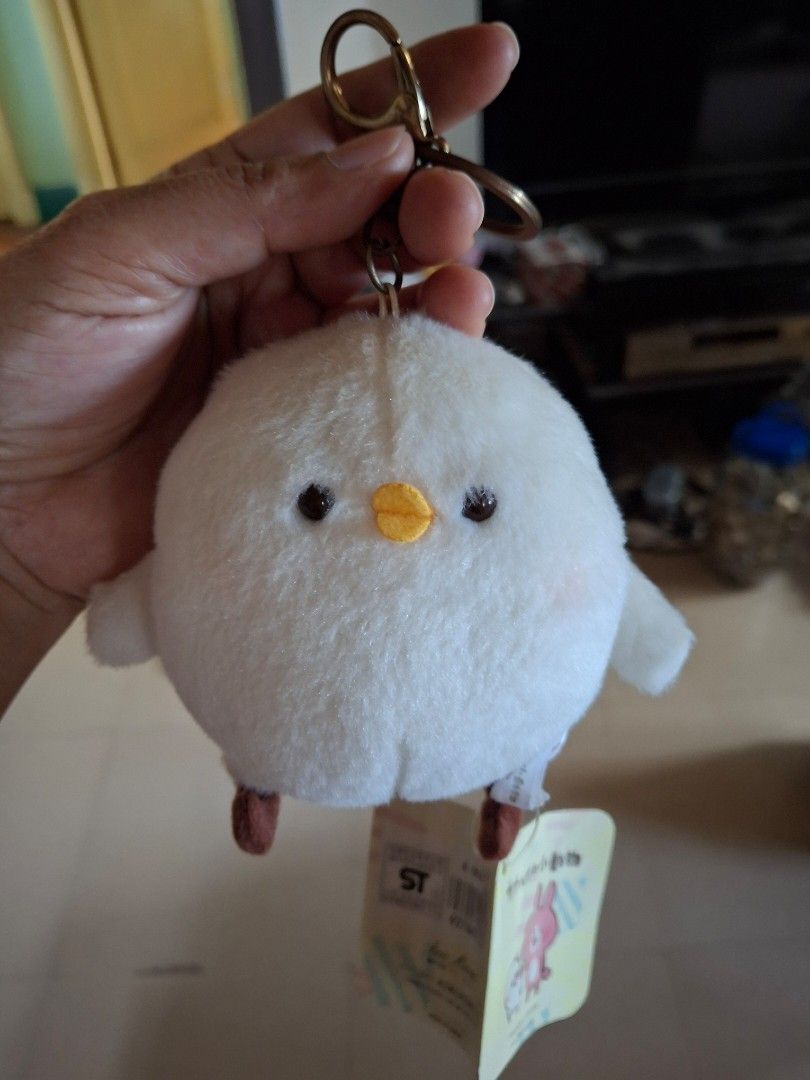 Kanahei's White Bird Keychain (Category: Plushies & Soft Toys) located in Quezon City. Submitted by pure_trinsky (Listing ID 1435714214, Image 1). Description: - Kanahei's Small Animals white bird plush keychain - Features a round, fluffy white bird design - Adorable yellow beak and small eyes - Comes with a gold-colored keychain clip - Includes the original tag with character illustrations - Great for adding cuteness to your bag or keys.