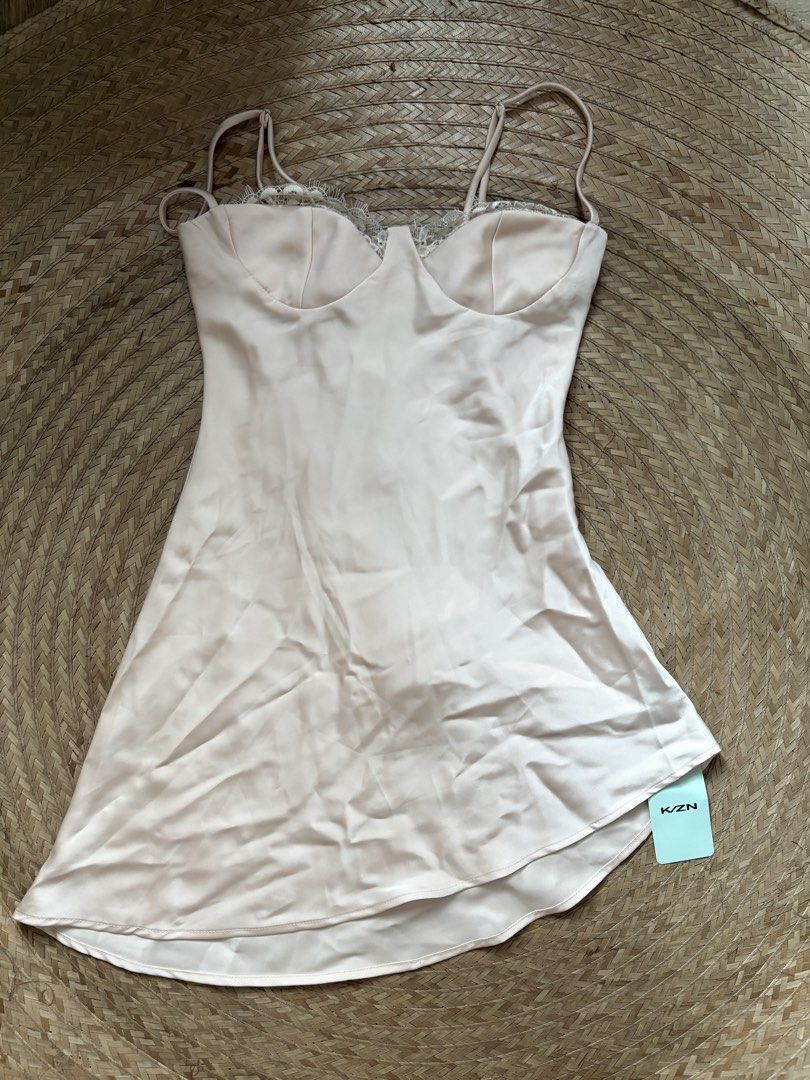 KZN Satin Slip Dress (Category: Dresses) located in Manila. Submitted by _foryou (Listing ID 1435779624, Image 1). Description: - KZN satin slip dress - Soft light pink color - Delicate lace detailing on bust - Thin spaghetti straps - Flattering silhouette - Slightly asymmetrical hem - Perfect for special occasions or nights out.