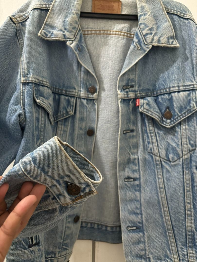 Levi's Original Trucker Denim Jacket (Category: Coats, Jackets and Outerwear) located in Manila. Submitted by aboutsammy (Listing ID 1435753836, Image 3). Description: - Authentic Levi's denim jacket - Classic light blue wash - Button-down closure - Two chest pockets - Features Levi's red tab and leather patch - Vintage look with wear on collar and cuffs - Perfect for layering DM for last price offer..
