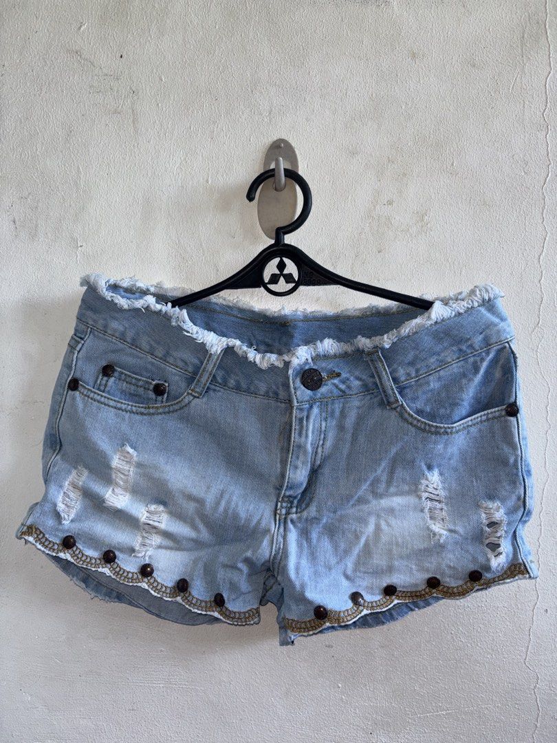Light Blue Denim Shorts/bottoms/skirts (Category: Shorts) located in Manila. Submitted by genesaysss (Listing ID 1435901332, Image 1). Description: Light blue denim shorts with distressed details. Features a button closure and pockets. The shorts have decorative beading along the hemline. The edges of the shorts are frayed/random bottoms and skirts Size 29-30, 50 each.