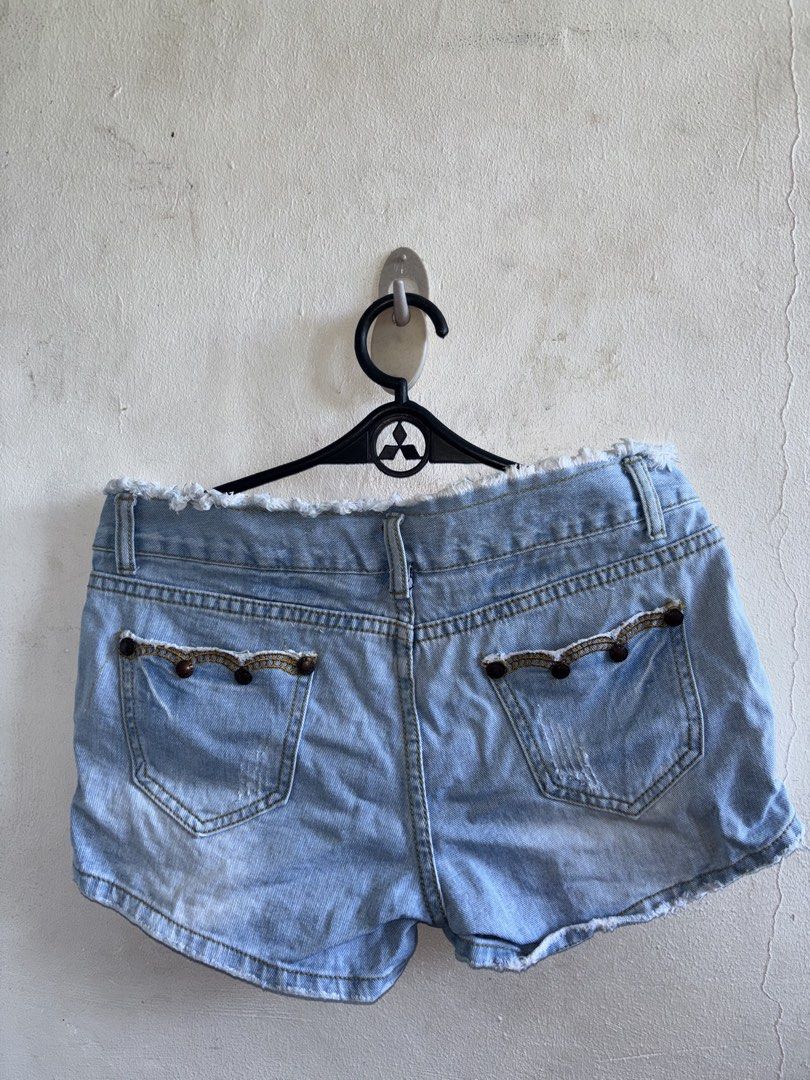 Light Blue Denim Shorts/bottoms/skirts (Category: Shorts) located in Manila. Submitted by genesaysss (Listing ID 1435901332, Image 2). Description: Light blue denim shorts with distressed details. Features a button closure and pockets. The shorts have decorative beading along the hemline. The edges of the shorts are frayed/random bottoms and skirts Size 29-30, 50 each.