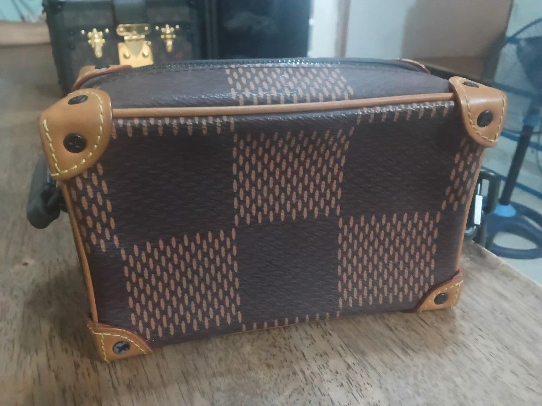 Louis Vuitton Mini Soft Trunk Bag (Category: Luxury Bags & Wallets) located in Bacoor. Submitted by tgkcac (Listing ID 1435729987, Image 3). Description: - Louis Vuitton Mini Soft Trunk - Japan Haul - Iconic brown checkered pattern with LV monogram - Black chain strap - Tan leather accents - Zippered closure - Spacious interior - Light cream-colored interior lining - Stylish and compact design.