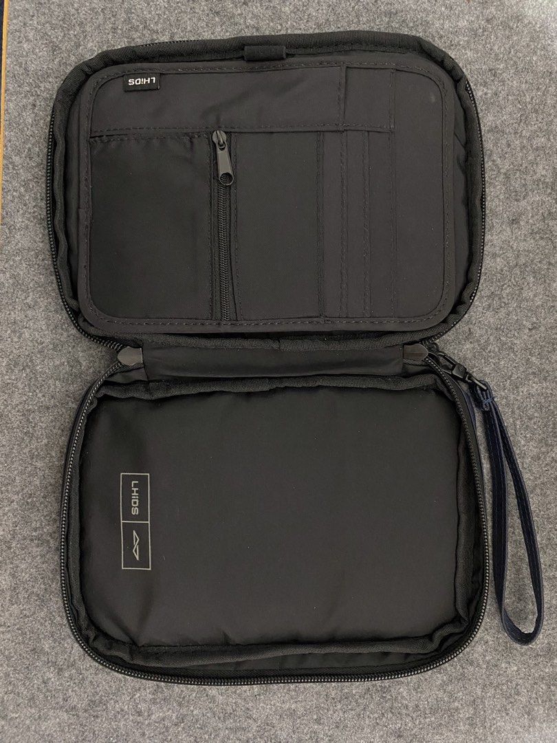 Magpac LHIDS slim pouch (Category: Cases & Sleeves) located in Pasig City. Submitted by fountainpenmd (Listing ID 1435760044, Image 2). Description: - LHIDS pouch be used as tablet case in a sleek dark blue design. -Perfect for ipad mini. - Offers comprehensive protection for your tablet. - Includes detachable magnetic organizer. - Features a secure zippered pocket. - Convenient front pocket with zipper and back pocket. - Comes with a wrist strap