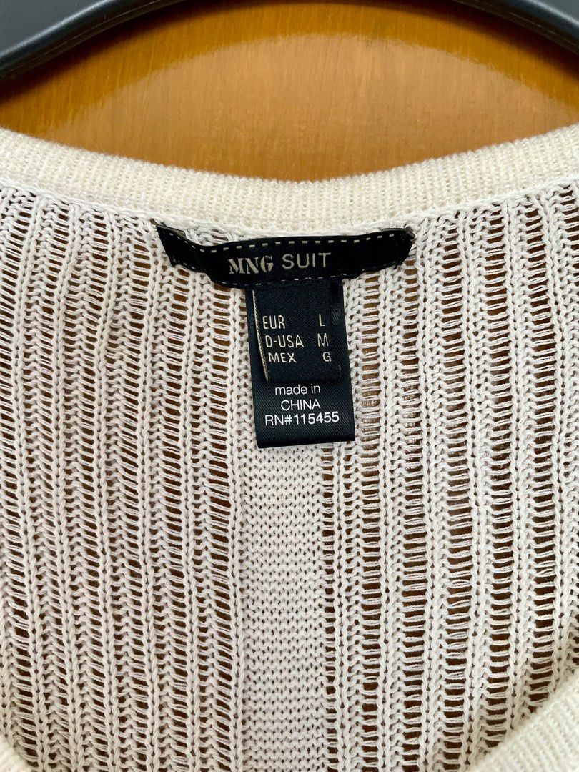 Mango knitted buttondown cardigan (Category: Blouses) located in Antipolo. Submitted by anikacruz (Listing ID 1435733619, Image 2). Description: Mango knitted buttondown cardigan Crochet style, open stitch pattern Fits medium to large Has barely noticeable yellow stains due to prolonged storage .