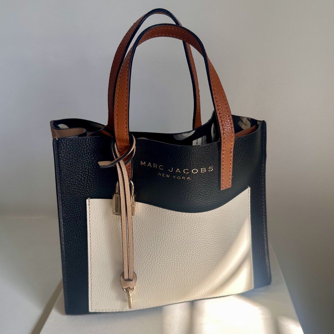 Marc Jacobs Mini Grind Tote in Smoke Almond (Category: Luxury Bags & Wallets) located in San Pablo. Submitted by louiseeeej (Listing ID 1435716625, Image 2). Description: Authentic With tags inside In Smoke Almond color 9/10 condition LP posted, selling low already 😊.