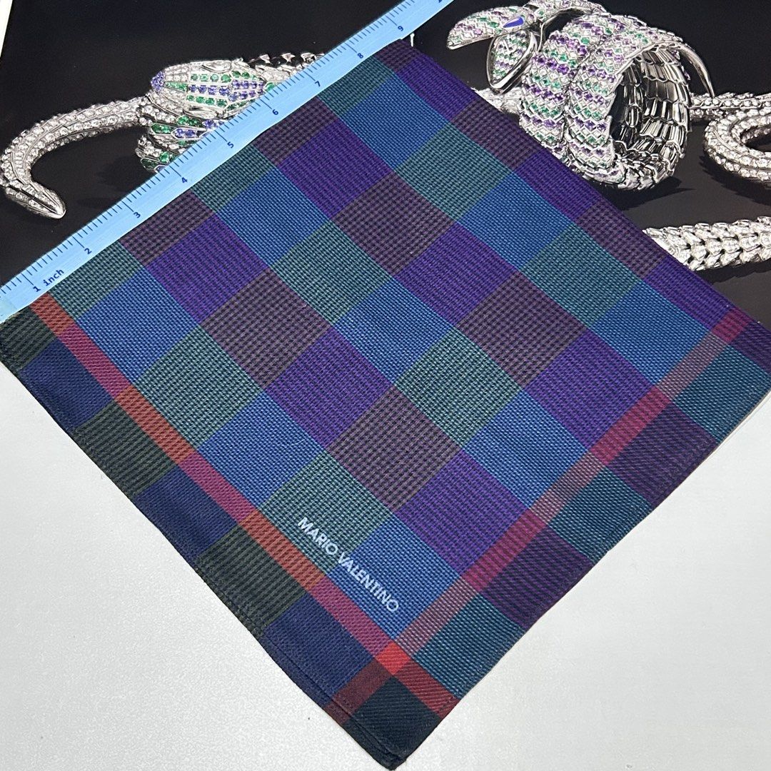 Mario Valentino Plaid Handkerchief (Category: Handkerchief & Pocket Squares) located in Bulacan. Submitted by Tuabliss (Listing ID 1435888822, Image 1). Description: - Mario Valentino handkerchief - Features a classic plaid pattern - Colors: Blue, green, and purple - Red border - Made of fine fabric - Adds a touch of elegance.