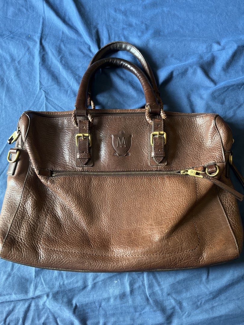 Massimo Dutti Men’s bag Vintage briefcase original (Category: Luxury Bags & Wallets) located in Mandaluyong City. Submitted by moonywinks (Listing ID 1435720415, Image 1). Description: RFS: no longer using, bought it for 10k++ Brown pebbled (grained) bovine leather with antique gold-tone hardware This bag is a Massimo Dutti brown pebbled leather briefcase or travel bag. It is distinguished by the brand’s signature embossed crest logo featuring a 