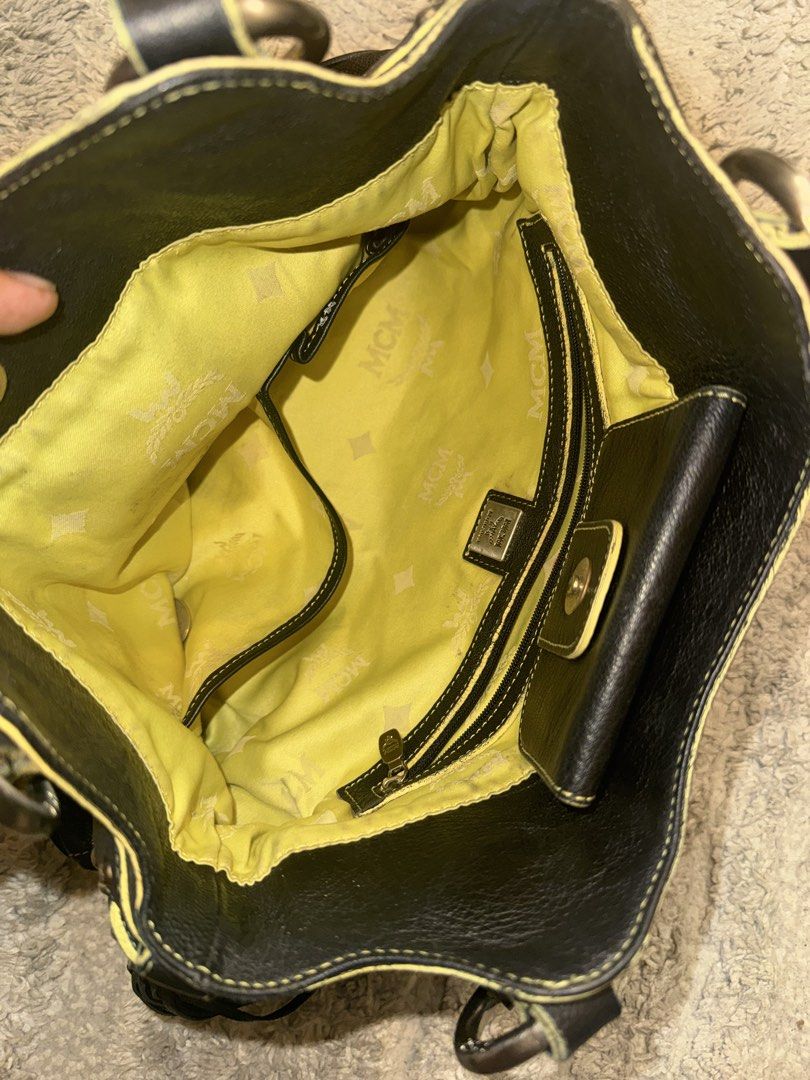 MCM Black Leather Tote Bag (Category: Luxury Bags & Wallets) located in Cavite. Submitted by pepayphilips (Listing ID 1435745735, Image 3). Description: Mcm shoulder bag/ tote NGA bought from online shop Cracks on rubber lining Leather body good condition .
