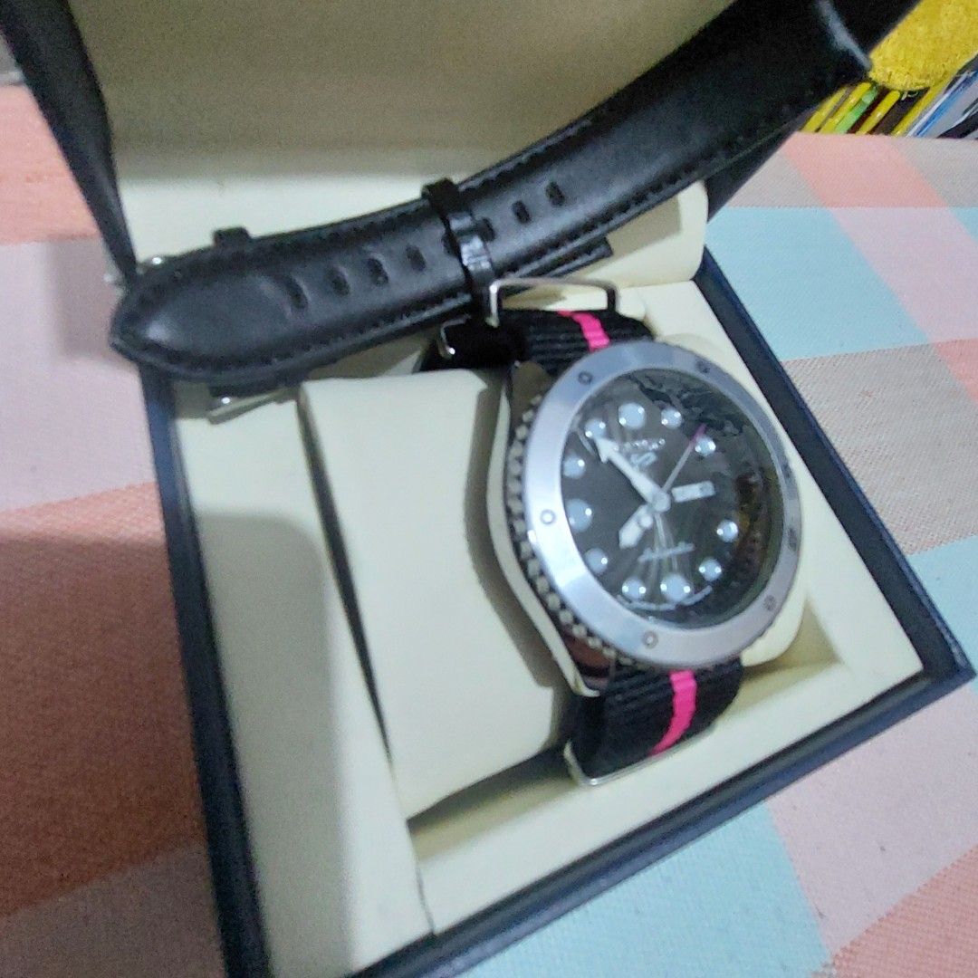 MEN s Watch (Category: Men's Watches) located in Antipolo. Submitted by uncovidspace (Listing ID 1435857256, Image 1). Description: - Seiko 5 watch (premium copy) - Black dial - Silver bezel - Day-date display - Black and pink striped strap - Additional black leather strap - Comes with original box note: need to change battery due to not being used .
