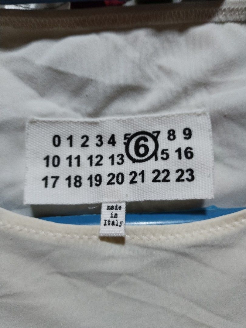 MM6 Maison Margiela White Bodysuit (Category: Longsleeves) located in Mandaue City. Submitted by chaseandchast (Listing ID 1435818946, Image 3). Description: MM6 Maison Margiela White Bodysuit Small Excellent condition Color rate - 9.5/10 Issue - stain at the back (see last pic) plus shipping fee.