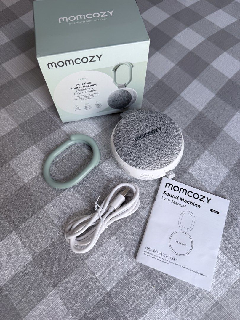 Momcozy Portable Sound Machine (Category: Other Home Appliances) located in Tanza. Submitted by mightystar-133e08 (Listing ID 1435724881, Image 1). Description: - Momcozy VN06 Sound Machine - 20 soothing sounds - Integrated night light - Includes USB charging cable - Comes with user manual - Features a hanging loop - Volume and light controls are indicated on the box -slightly negotiable .