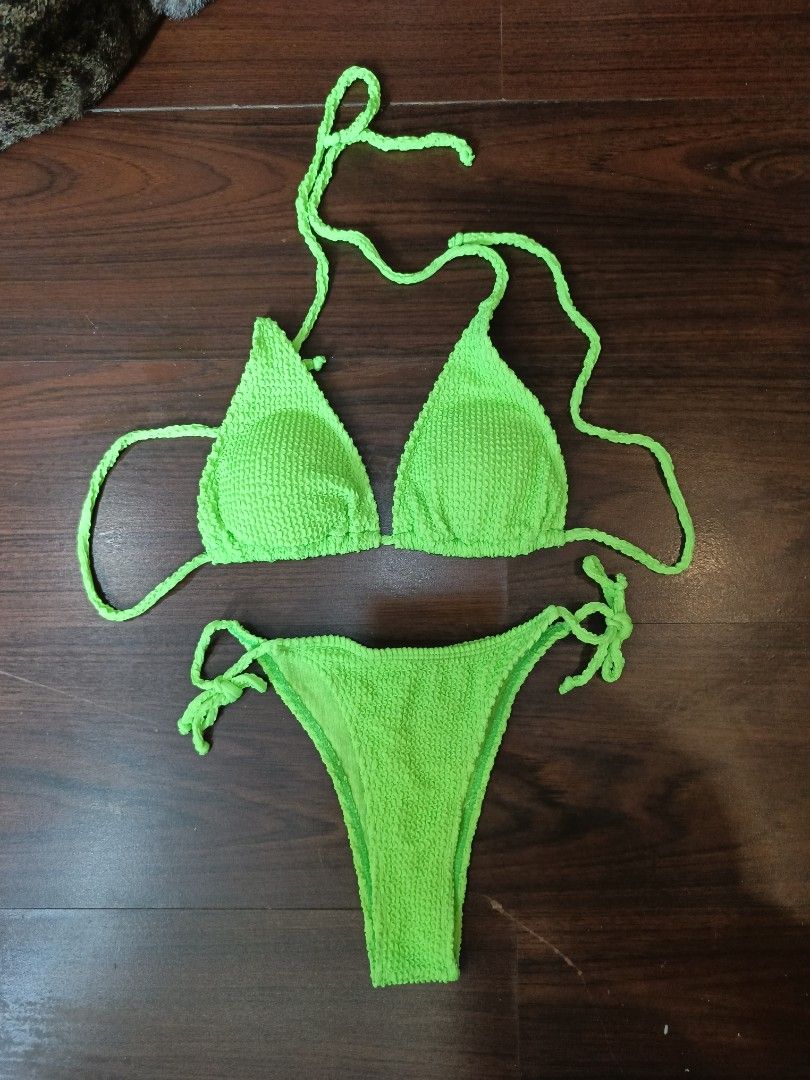 Neon Green Bikini Set (Category: Bikinis & Swimsuits) located in Pasig City. Submitted by reginamael23023 (Listing ID 1435911729, Image 1). Description: - Neon green bikini set - Triangle top with adjustable straps - High-cut bottom - Textured fabric - Great for beach or pool parties.