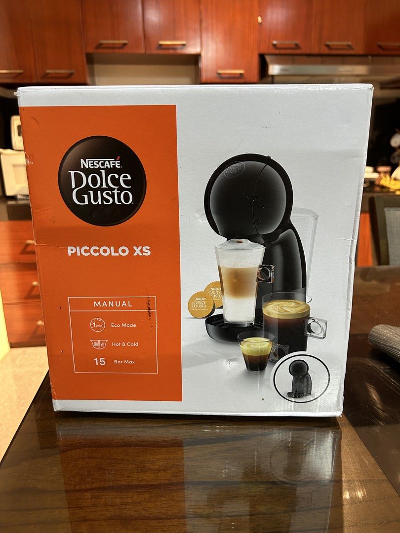 Nescafe Dolce Gusto Piccolo XS Coffee Machine (Category: Coffee Machines & Makers) located in Manila. Submitted by kimiyuuuh (Listing ID 1435861459, Image 2). Description: - Nescafe Dolce Gusto Piccolo XS Coffee Machine - Color: Black - Includes original box and user manual - Compact design, great for small spaces - Easy to use and clean.