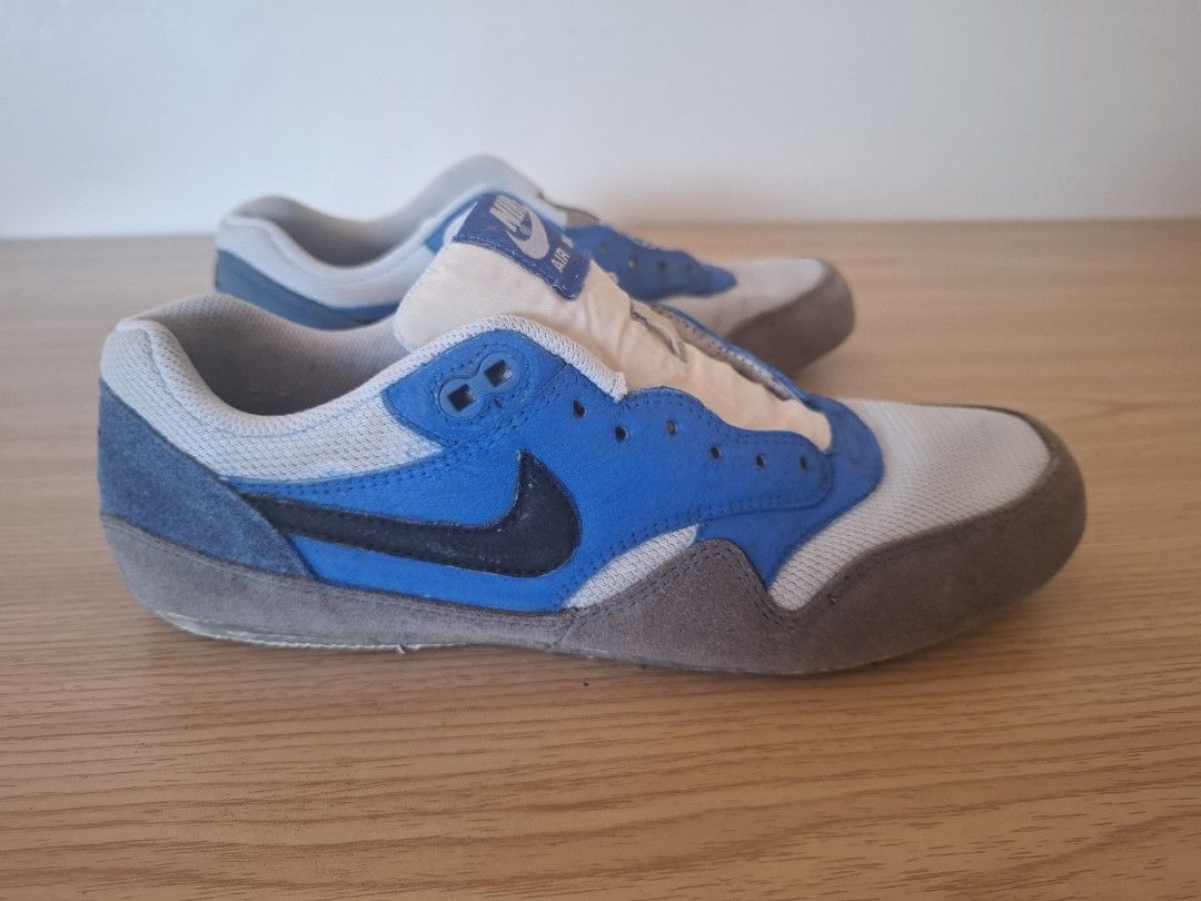 Nike Air Max 1 Sneakers Open for Swapping (Category: Sneakers) located in Quezon City. Submitted by sgtshae (Listing ID 1435810615, Image 3). Description: - Nike Air Max 1 sneakers - Color: Blue, white, and grey - Iconic Nike swoosh - Signs of wear on soles - Blue and white tongue - Grey toe cap - Nike Air logo on heel.