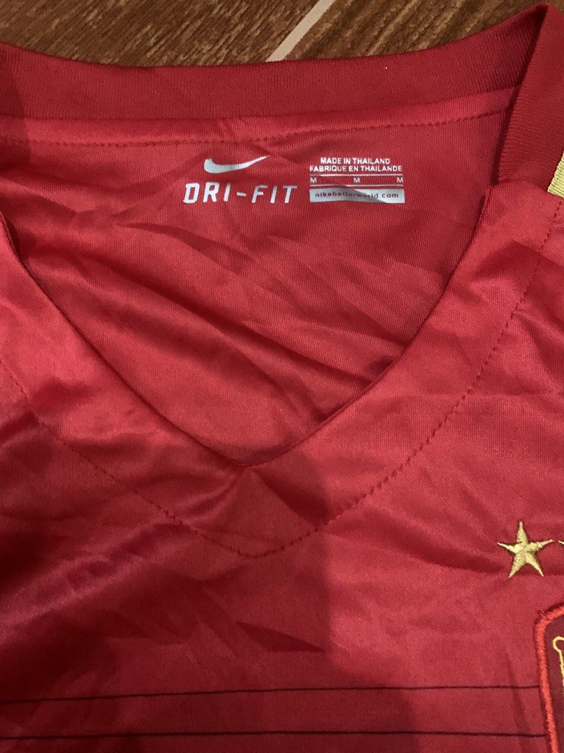 Nike Guangzhou Evergrande Jersey (Category: Activewear) located in Cavite. Submitted by secondhandco.archive552 (Listing ID 1435882230, Image 2). Description: NIKE EVERGRANDE 📌NO ISSUE 📌COLOR RATE: 9/10 📌CONDITION: 9/10 - Authentic Nike Guangzhou Evergrande jersey - Color: Red with yellow accents - Features team logo and "EVERGRANDE" print - V-neck design - Nike logo visible - Made in Thailand.