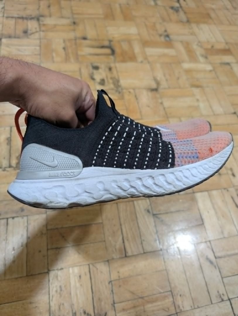 Nike React Phantom Run Flyknit 2 - Black/Orange/Grey (Category: Sneakers) located in Quezon City. Submitted by trainforless (Listing ID 1435856123, Image 2). Description: Size: US: 9.5 UK: 8.5 EUR: 43 CM: 27.5 Experience the ultimate "laceless" comfort. These Nike React Phantom Run Flyknit 2s are designed for runners and casual wearers who want a snug, sock-like fit without the hassle of laces. The React foam is still incredibly bouncy and provid