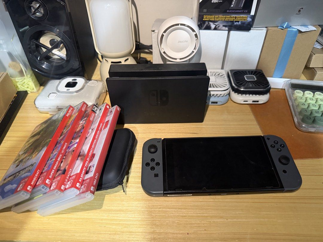 Nintendo Switch Console with Accessories (Category: Nintendo) located in Manila. Submitted by manthonyt51673 (Listing ID 1435867952, Image 3). Description: - Nintendo Switch console with Joy-Con controllers - Includes dock, AC adapter, and HDMI cable - Comes with a carrying case and Joy-Con grip - Game cartridges included: Minecraft, Super Smash Bros. Ultimate, NBA 2K21, and more!.
