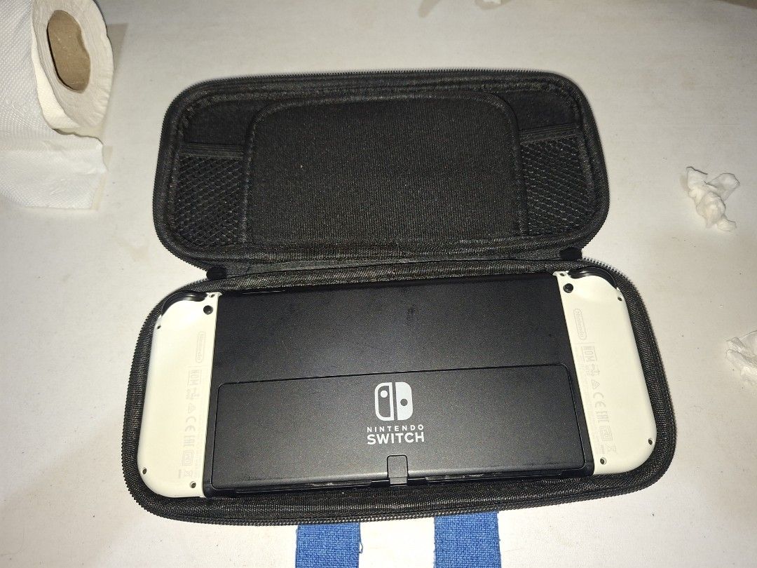 Nintendo Switch OLED White (Category: Nintendo) located in Caloocan City. Submitted by jezrenezon85402 (Listing ID 1435879476, Image 3). Description: - Japanese Nintendo Switch OLED model - White Joy-Cons - Includes a mario carrying case -256gb Sd card -Free Protective silicon case -Comes with all accesories except charger -No box Issue: Napatakan ng alcohol ung left speaker, medjo parang warerlogged ung tunog Price is Negotiable Rfs: For Gpu.
