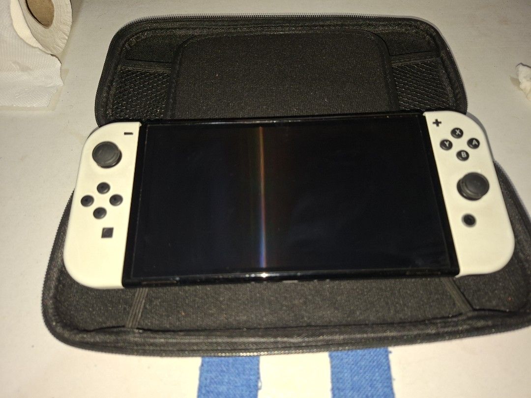 Nintendo Switch OLED White (Category: Nintendo) located in Caloocan City. Submitted by jezrenezon85402 (Listing ID 1435879476, Image 1). Description: - Japanese Nintendo Switch OLED model - White Joy-Cons - Includes a mario carrying case -256gb Sd card -Free Protective silicon case -Comes with all accesories except charger -No box Issue: Napatakan ng alcohol ung left speaker, medjo parang warerlogged ung tunog Price is Negotiable Rfs: For Gpu.